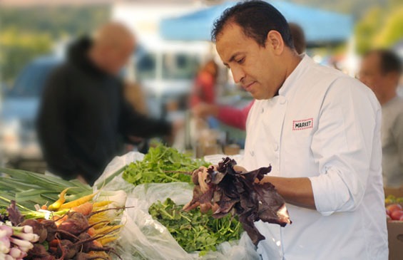 Chef Ernesto Selecting Fresh Local Produce For Market Restaurant