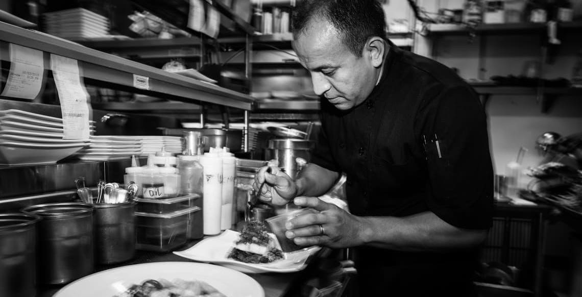 Chef Ernesto In The Kitchen At Market Saint Helena